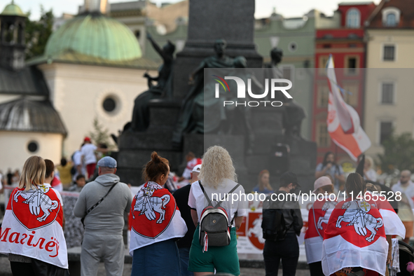 KRAKOW, POLAND - AUGUST 9:
Members of the Belarusian diaspora, many displaying white-red-white opposition flags, gather at Krakow's Market S...