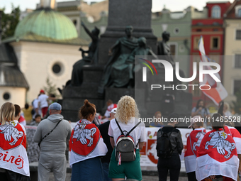 KRAKOW, POLAND - AUGUST 9:
Members of the Belarusian diaspora, many displaying white-red-white opposition flags, gather at Krakow's Market S...