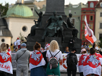 KRAKOW, POLAND - AUGUST 9:
Members of the Belarusian diaspora, many displaying white-red-white opposition flags, gather at Krakow's Market S...