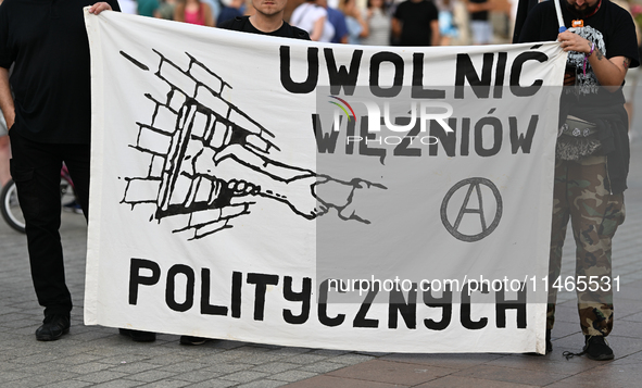 KRAKOW, POLAND - AUGUST 9:
Activists hold a banner reading 'Free Political Prisoners' during the Day of Solidarity with Belarus rally, on Au...