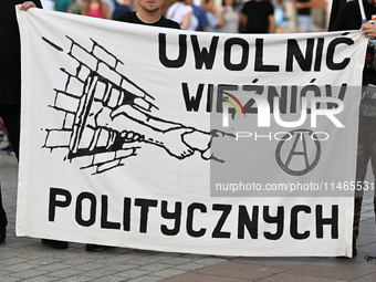 KRAKOW, POLAND - AUGUST 9:
Activists hold a banner reading 'Free Political Prisoners' during the Day of Solidarity with Belarus rally, on Au...