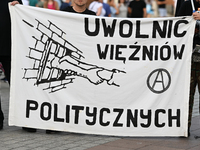 KRAKOW, POLAND - AUGUST 9:
Activists hold a banner reading 'Free Political Prisoners' during the Day of Solidarity with Belarus rally, on Au...