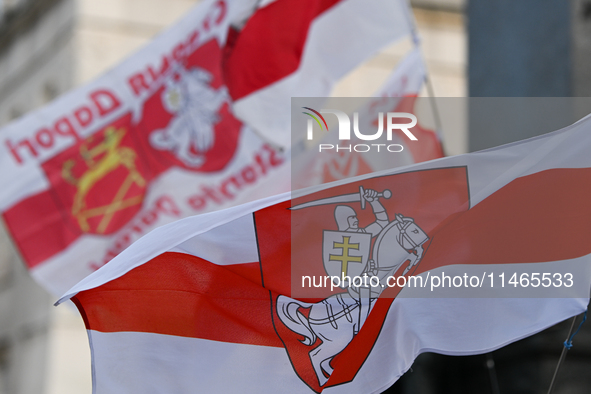 KRAKOW, POLAND - AUGUST 9:
Members of the Belarusian diaspora displaying white-red-white opposition flags as they gather at Krakow's Market...