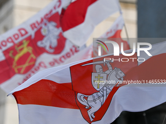 KRAKOW, POLAND - AUGUST 9:
Members of the Belarusian diaspora displaying white-red-white opposition flags as they gather at Krakow's Market...