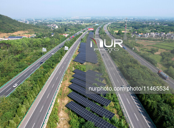 A sub-belt photovoltaic power station is being shown in the G5011 Wuhu-Hefei Expressway test tunnel in Chaohu, China, on August 9, 2024. 