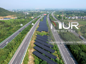 A sub-belt photovoltaic power station is being shown in the G5011 Wuhu-Hefei Expressway test tunnel in Chaohu, China, on August 9, 2024. (