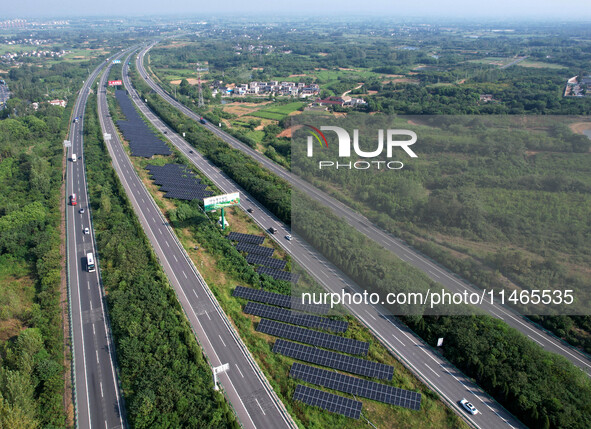 A sub-belt photovoltaic power station is being shown in the G5011 Wuhu-Hefei Expressway test tunnel in Chaohu, China, on August 9, 2024. 