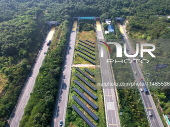 A sub-belt photovoltaic power station is being shown in the G5011 Wuhu-Hefei Expressway test tunnel in Chaohu, China, on August 9, 2024. (