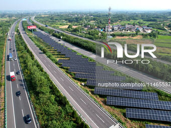 A sub-belt photovoltaic power station is being shown in the G5011 Wuhu-Hefei Expressway test tunnel in Chaohu, China, on August 9, 2024. (