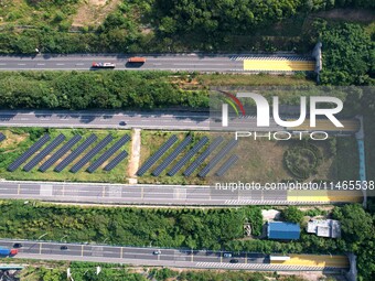 A sub-belt photovoltaic power station is being shown in the G5011 Wuhu-Hefei Expressway test tunnel in Chaohu, China, on August 9, 2024. (