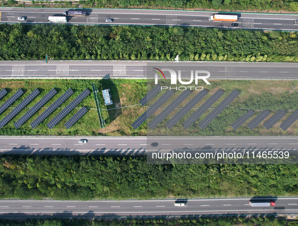 A sub-belt photovoltaic power station is being shown in the G5011 Wuhu-Hefei Expressway test tunnel in Chaohu, China, on August 9, 2024. 