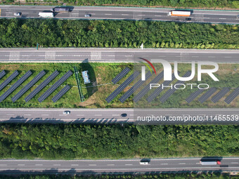 A sub-belt photovoltaic power station is being shown in the G5011 Wuhu-Hefei Expressway test tunnel in Chaohu, China, on August 9, 2024. (