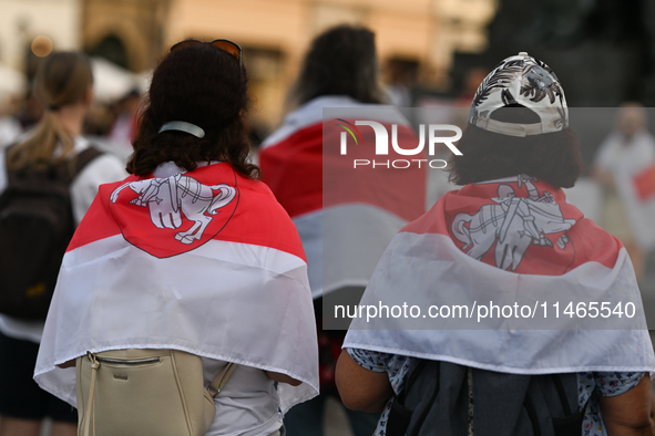 KRAKOW, POLAND - AUGUST 9:
Members of the Belarusian diaspora, many displaying white-red-white opposition flags, gather at Krakow's Market S...