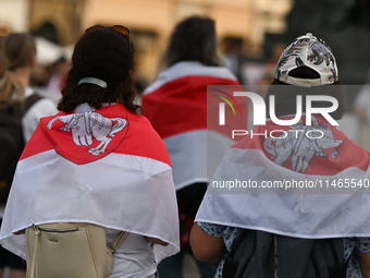 KRAKOW, POLAND - AUGUST 9:
Members of the Belarusian diaspora, many displaying white-red-white opposition flags, gather at Krakow's Market S...