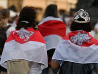 KRAKOW, POLAND - AUGUST 9:
Members of the Belarusian diaspora, many displaying white-red-white opposition flags, gather at Krakow's Market S...