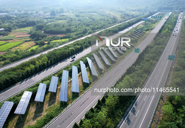 A sub-belt photovoltaic power station is being shown in the G5011 Wuhu-Hefei Expressway test tunnel in Chaohu, China, on August 9, 2024. 