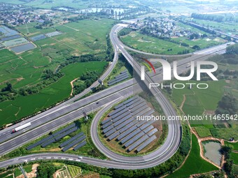 A sub-belt photovoltaic power station is being shown in the G5011 Wuhu-Hefei Expressway test tunnel in Chaohu, China, on August 9, 2024. (