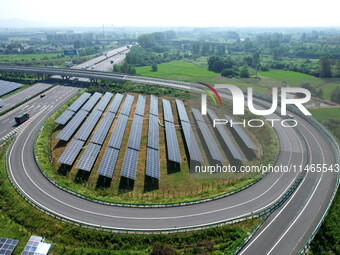 A sub-belt photovoltaic power station is being shown in the G5011 Wuhu-Hefei Expressway test tunnel in Chaohu, China, on August 9, 2024. (