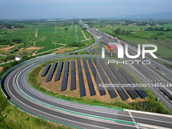 A sub-belt photovoltaic power station is being shown in the G5011 Wuhu-Hefei Expressway test tunnel in Chaohu, China, on August 9, 2024. (