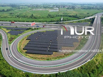 A sub-belt photovoltaic power station is being shown in the G5011 Wuhu-Hefei Expressway test tunnel in Chaohu, China, on August 9, 2024. (