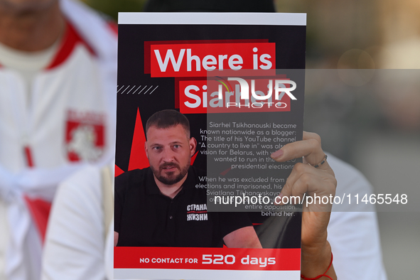 KRAKOW, POLAND - AUGUST 9:
A member of the Belarusian diaspora holds a poster with the inscription 'Where is Siarhei? No contact for 520 day...