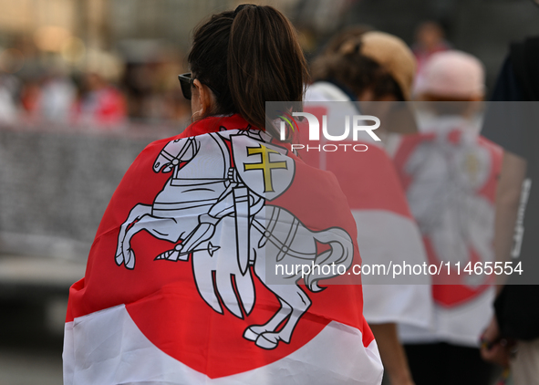 KRAKOW, POLAND - AUGUST 9:
Members of the Belarusian diaspora, many displaying white-red-white opposition flags, gather at Krakow's Market S...