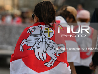 KRAKOW, POLAND - AUGUST 9:
Members of the Belarusian diaspora, many displaying white-red-white opposition flags, gather at Krakow's Market S...