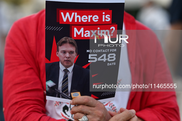 KRAKOW, POLAND - AUGUST 9:
A member of the Belarusian diaspora holds a poster with the inscription 'Where is Maxim? No contact for 548 days,...