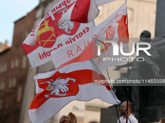 KRAKOW, POLAND - AUGUST 9:
Members of the Belarusian diaspora displaying white-red-white opposition flags as they gather at Krakow's Market...