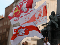 KRAKOW, POLAND - AUGUST 9:
Members of the Belarusian diaspora displaying white-red-white opposition flags as they gather at Krakow's Market...