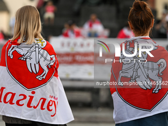 KRAKOW, POLAND - AUGUST 9:
Members of the Belarusian diaspora, many displaying white-red-white opposition flags, gather at Krakow's Market S...