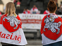 KRAKOW, POLAND - AUGUST 9:
Members of the Belarusian diaspora, many displaying white-red-white opposition flags, gather at Krakow's Market S...