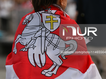 KRAKOW, POLAND - AUGUST 9:
A member of the Belarusian diaspora displaying white-red-white opposition flags during the Day of Solidarity with...