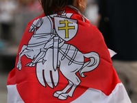 KRAKOW, POLAND - AUGUST 9:
A member of the Belarusian diaspora displaying white-red-white opposition flags during the Day of Solidarity with...