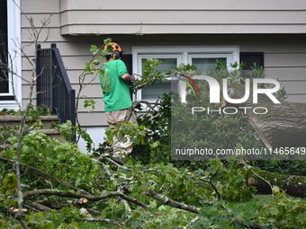 A large tree is uprooting and causing major damage to a home on Wynetta Place during severe weather impacting the northeastern United States...