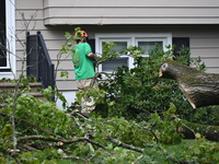 A large tree is uprooting and causing major damage to a home on Wynetta Place during severe weather impacting the northeastern United States...