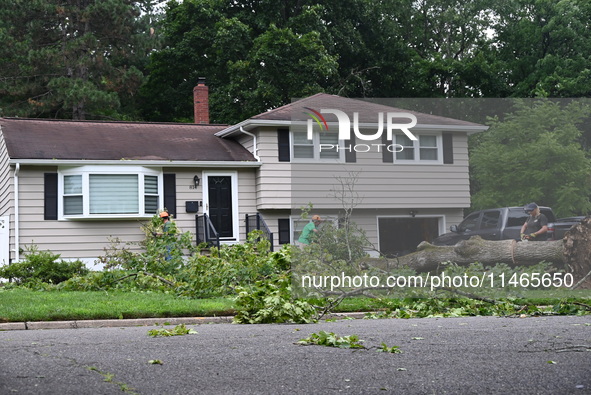 A large tree is uprooting and causing major damage to a home on Wynetta Place during severe weather impacting the northeastern United States...