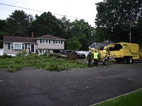 A large tree is uprooting and causing major damage to a home on Wynetta Place during severe weather impacting the northeastern United States...