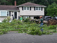 A large tree is uprooting and causing major damage to a home on Wynetta Place during severe weather impacting the northeastern United States...