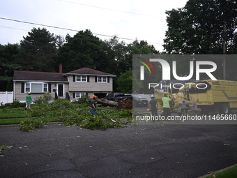 A large tree is uprooting and causing major damage to a home on Wynetta Place during severe weather impacting the northeastern United States...