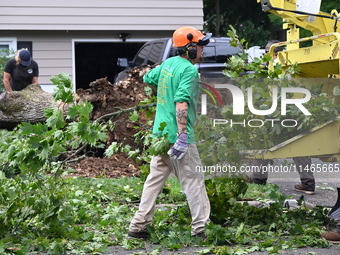 A large tree is uprooting and causing major damage to a home on Wynetta Place during severe weather impacting the northeastern United States...