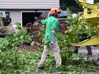 A large tree is uprooting and causing major damage to a home on Wynetta Place during severe weather impacting the northeastern United States...