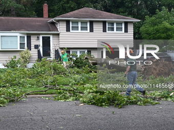 A large tree is uprooting and causing major damage to a home on Wynetta Place during severe weather impacting the northeastern United States...