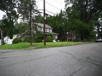 A large tree is damaging a fence, causing power lines to come down, and causing severe damage to a home during severe weather impacting the...