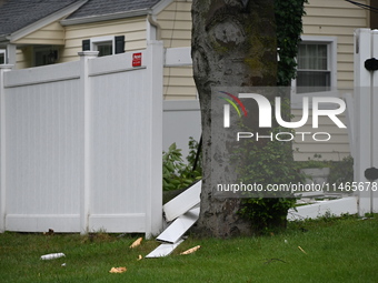 A large tree is damaging a fence, causing power lines to come down, and causing severe damage to a home during severe weather impacting the...