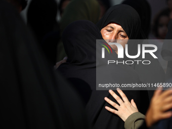 Palestinians are mourning by the bodies of relatives killed in Israeli bombardment on Nuseirat in the central Gaza Strip at Al-Aqsa Martyrs...