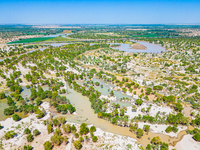 The meandering Tarim River is nourishing vegetation along its banks in the Weili section of the middle and lower reaches of the Tarim River...