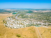 The meandering Tarim River is nourishing vegetation along its banks in the Weili section of the middle and lower reaches of the Tarim River...