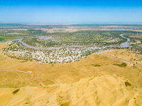 The meandering Tarim River is nourishing vegetation along its banks in the Weili section of the middle and lower reaches of the Tarim River...