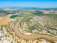 The meandering Tarim River is nourishing vegetation along its banks in the Weili section of the middle and lower reaches of the Tarim River...